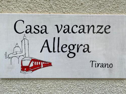 a sign with a drawing of a train on a wall at Miralago Apartments - 8 min Walk to Bernina Express in Tirano