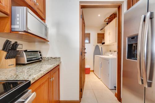 a kitchen with a counter top and a refrigerator at Oceanica 804 in Playa Flamingo