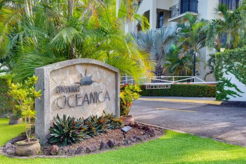 a sign for the entrance to a resort at Oceanica 804 in Playa Flamingo
