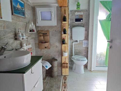 a bathroom with a sink and a toilet at Villa Irma guest house in Crotone