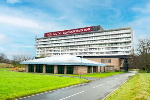 a large building with a sign on top of it at Muthu Glasgow River Hotel in Erskine
