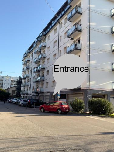 a red car parked in front of a building at venice popular residence in Mestre