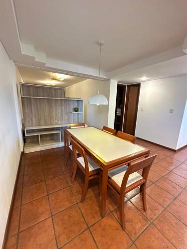 a kitchen with a table and chairs in a room at Hotel boutique Tramas Andinas in Salta