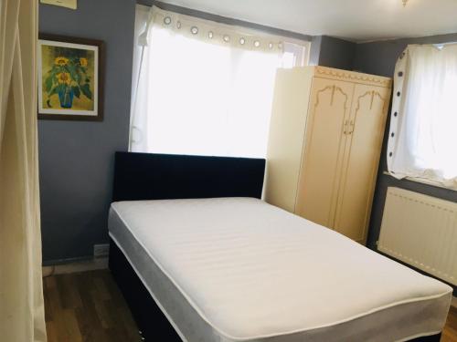 a small bed in a room with a window at Goldicroft House Road in Wednesbury
