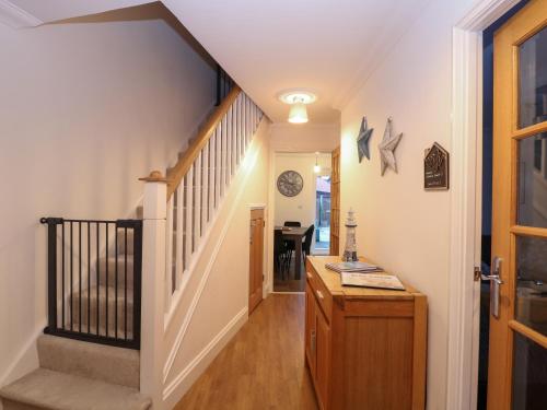 a hallway of a home with a staircase and a stair case at 19 Stablefield Way in Great Yarmouth