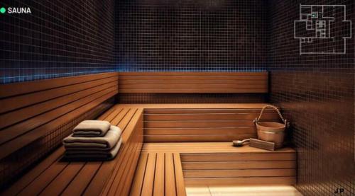 a sauna with two towels and a bucket in it at Apto alto padrao ao lado do IBIS - Av Esmeraldas in Marília