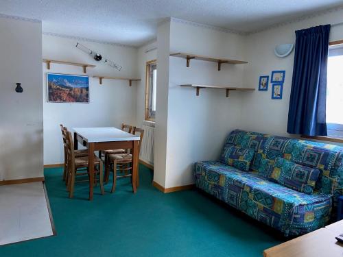 a living room with a couch and a table at Mountain View in Passo del Tonale