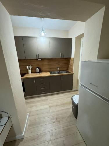 Virtuvė arba virtuvėlė apgyvendinimo įstaigoje Rian apartament