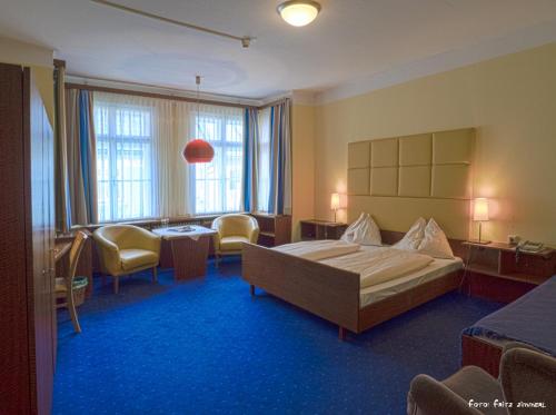 Postel nebo postele na pokoji v ubytování Hotel Drei Hasen