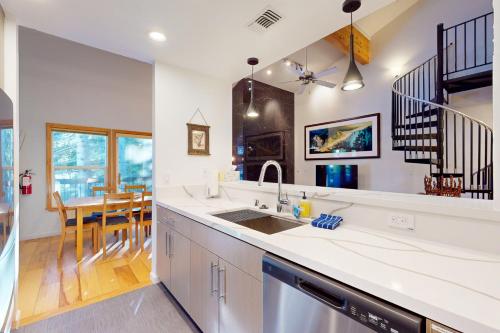 a kitchen with a sink and a dining room at Squaw Valley Ski Flat in Olympic Valley
