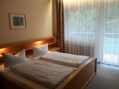 Ένα ή περισσότερα κρεβάτια σε δωμάτιο στο Hotel Park Eden