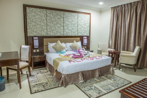 Vuode tai vuoteita majoituspaikassa Al Masem Luxury Hotel Suite 5