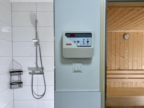 a bathroom with a shower and a door at Diemelblick 23 - DIEMELTJE in Heringhausen