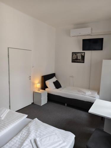 Cama o camas de una habitación en Hotel Bílý Koníček