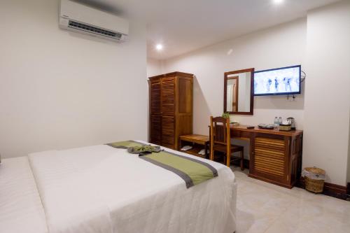 Ein Bett oder Betten in einem Zimmer der Unterkunft Relax Hotel