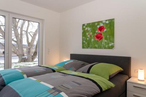 two beds sitting in a room with a window at Ferienhaus SONNENWEG 16 in Heringhausen