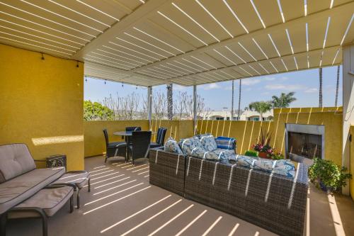 a covered patio with a couch and a fireplace at Sunny San Diego Escape Less Than 2 Miles to Pacific Beach! in San Diego