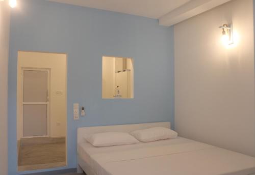 Postel nebo postele na pokoji v ubytování A.V.N HOMESTAY