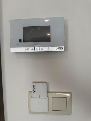a tv on a wall in a room at Su Apartment Side in Side