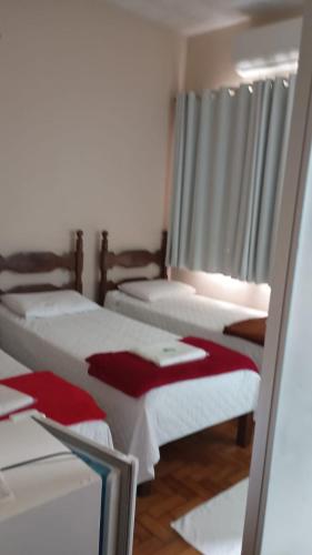 Una cama o camas en una habitación de Hotel Faria 2