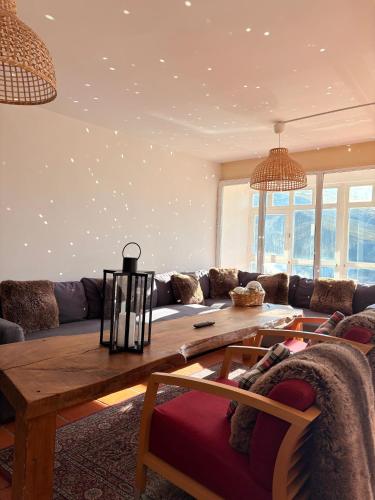 a living room with a couch and a table at Arrayanes Royal in Sierra Nevada