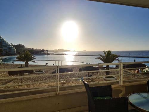 a view of the beach from the balcony of a resort at San Alfonso del Mar Departamentos in Algarrobo