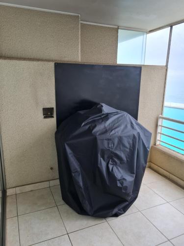 a room with a black tarp on a wall at San Alfonso del Mar Departamentos in Algarrobo