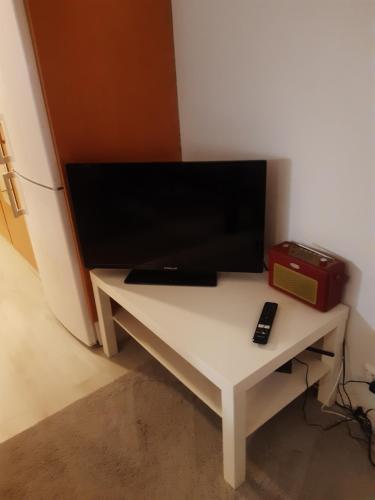 a white table with a tv on top of it at Kauppala, Soini kk in Soini