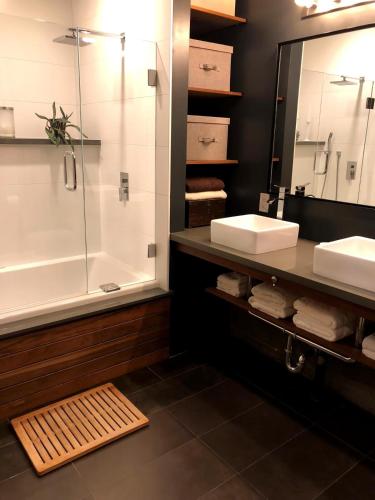 a bathroom with a shower and a sink and a tub at Beautiful Cottage, hot tub, in great neighborhood in San Francisco