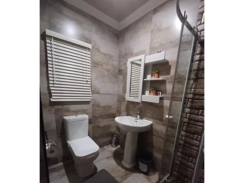 Ένα μπάνιο στο Delux Guesthouse