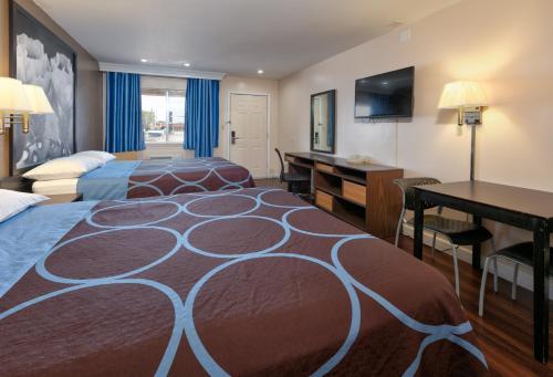 Katil atau katil-katil dalam bilik di Red River Inn Vernon, Tx