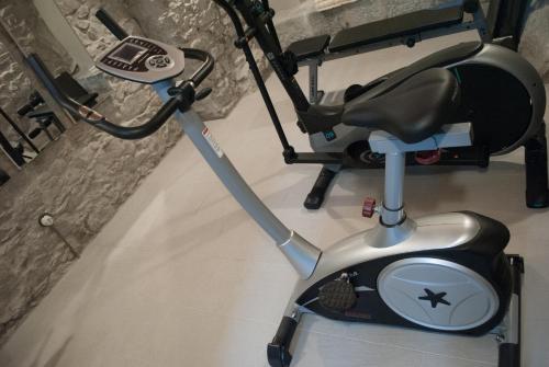 a scooter parked in a room next to a wall at Luxury Apartments Manarola by Arbaspàa in Manarola