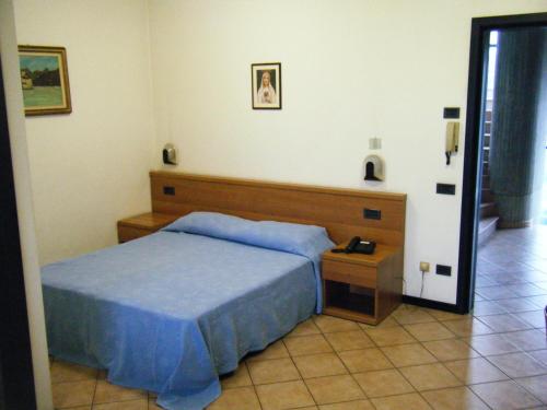 Кровать или кровати в номере Residence Vezzoli