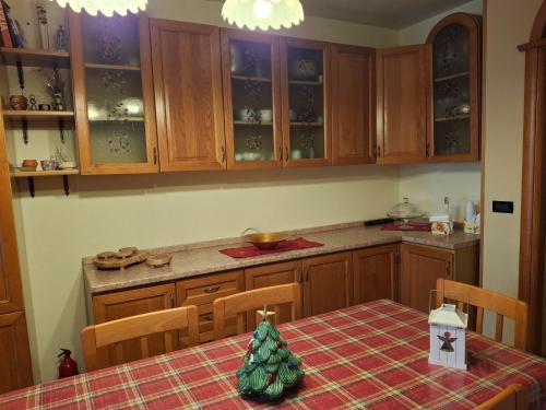a kitchen with a table with a christmas tree on it at Al Civico Centocinquantasei in Latiano