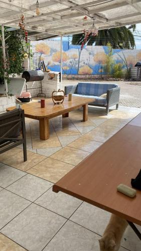 a living room with a table and an umbrella at Casona Campillay in La Serena