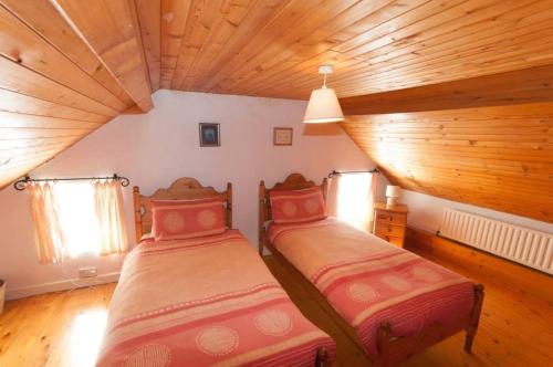 Postel nebo postele na pokoji v ubytování Smiths Cottage