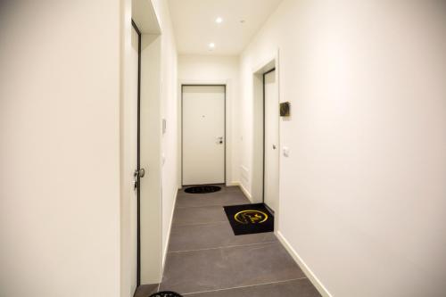 a hallway with a black bag on the floor at Callas Luxury Suite Verona in Verona