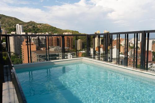 a swimming pool on the balcony of a building at HYPE STATES Cali in El Peñón