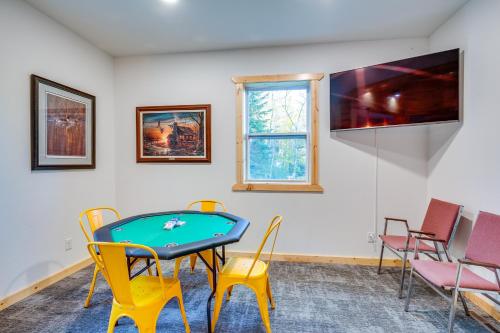 a room with a ping pong table and chairs at 15 Mi to Lake Superior Renovated Church with Grill in Toivola