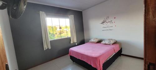 Postel nebo postele na pokoji v ubytování Cantinho do aconchego