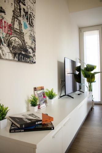 a white desk with a computer on top of it at Gonin 58 in Milan