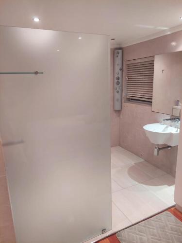 a bathroom with a toilet and a sink at EIGHT VILLA DE PORT iKamva in Port Alfred