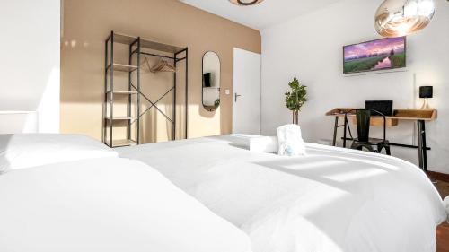 a bedroom with a large white bed and a ladder at Coloc Dormant - Hyper-centre, proche transports pour Genève. in Annemasse
