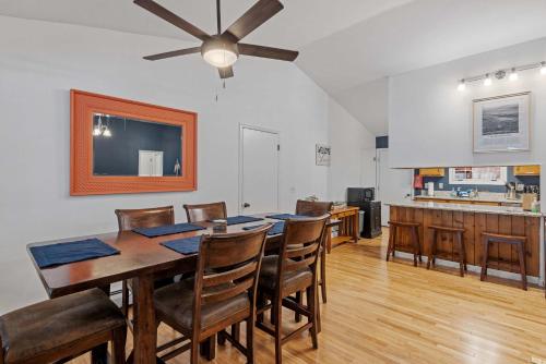 a dining room with a table and chairs at Tranquil 3BR Retreat Game Room Deck Beach Pass in Center Harbor