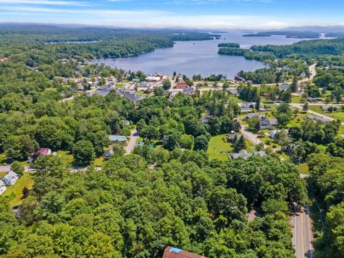 an aerial view of a town with a lake at Tranquil 3BR Retreat Game Room Deck Beach Pass in Center Harbor