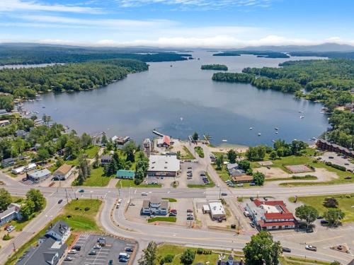an aerial view of a town and a lake at Tranquil 3BR Retreat Game Room Deck Beach Pass in Center Harbor