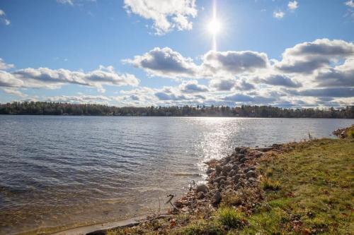 a large body of water with the sun in the sky at Halfmoon Lake 3BR Home w Game Room Deck Dock in Alton