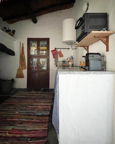Kuchyň nebo kuchyňský kout v ubytování Monte do Saltamontes