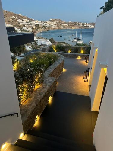 a view from the balcony of a house with lights at Noima Boutique Hotel Mykonos in Agios Ioannis Mykonos