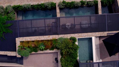 an overhead view of a building with plants on it at Noima Boutique Hotel Mykonos in Agios Ioannis Mykonos